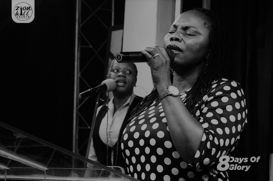 Rev Melody Abarra worshipping